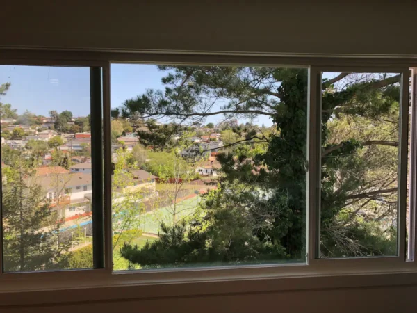 A view of the city from inside a window.