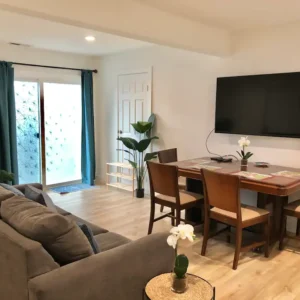 A living room with a couch and table