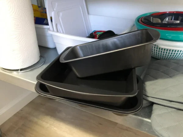 Two pans are stacked on top of each other.