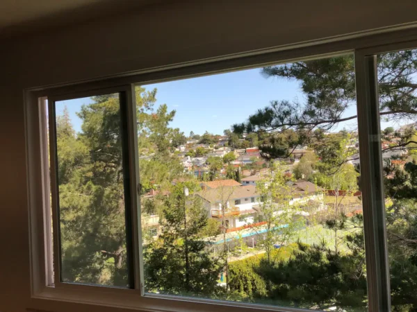 A view of the city from an open window.