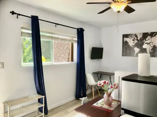 A living room with a tv and a table