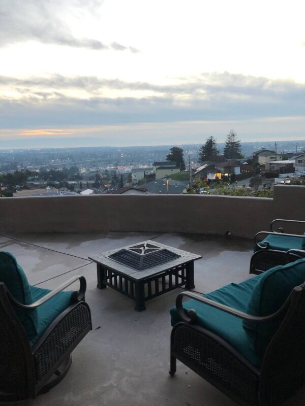 A fire pit sitting on top of a patio.