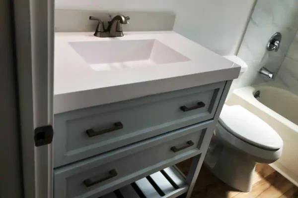 A bathroom with a sink and toilet in it