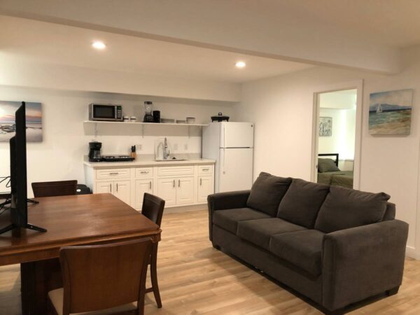 A living room with a couch and table in it