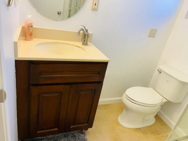 A bathroom with a sink and toilet in it