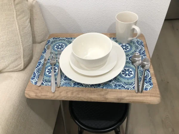 A table with plates and silverware on it.