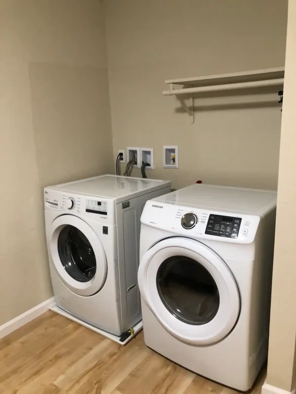 A couple of white appliances in a room.