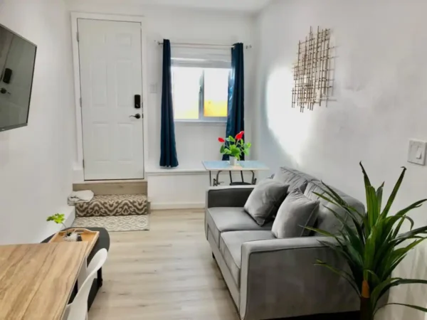 A living room with a couch and table