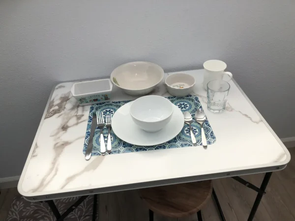 A table with bowls and plates on it