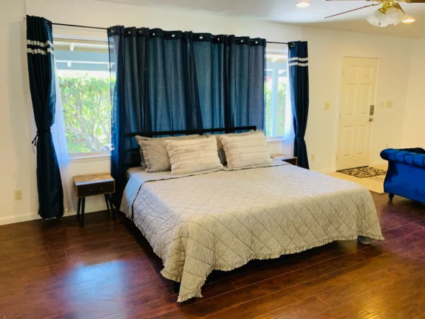 A large bed sitting in the middle of a room.