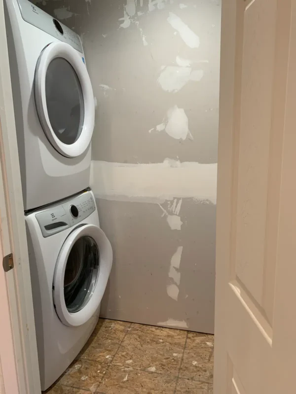 A white washer and dryer in a room.