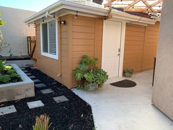 A house with a patio and garden area.