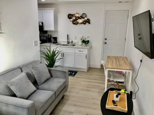 A living room with a couch and a table