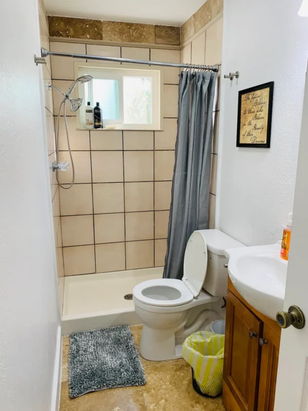 A bathroom with a toilet and sink in it