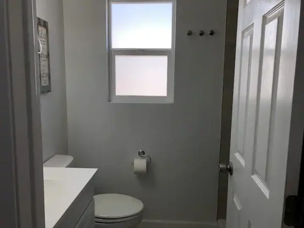 A bathroom with a toilet and sink in it