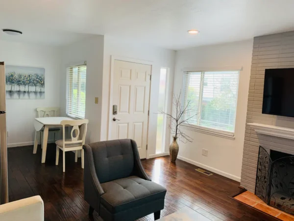 A living room with a chair and table in it