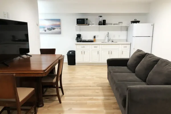 A living room with a couch and table